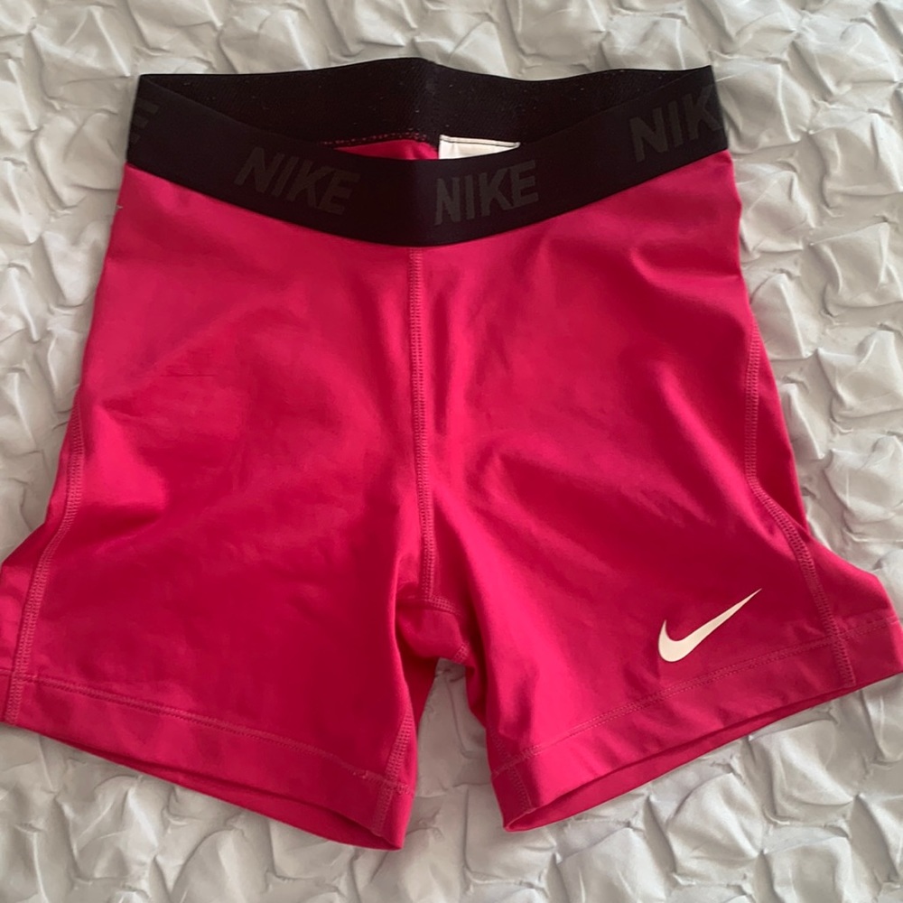 bright pink Nike Dri-fit biker shorts, soft silky material size small - Woman